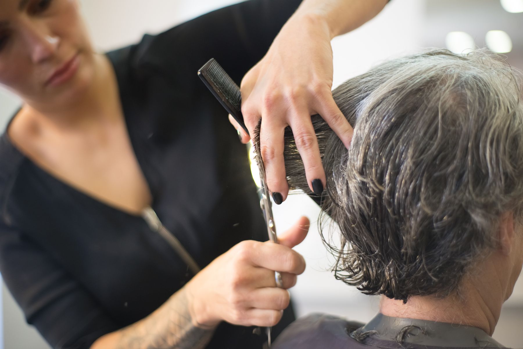 Hairdresser cutting a client's hair
